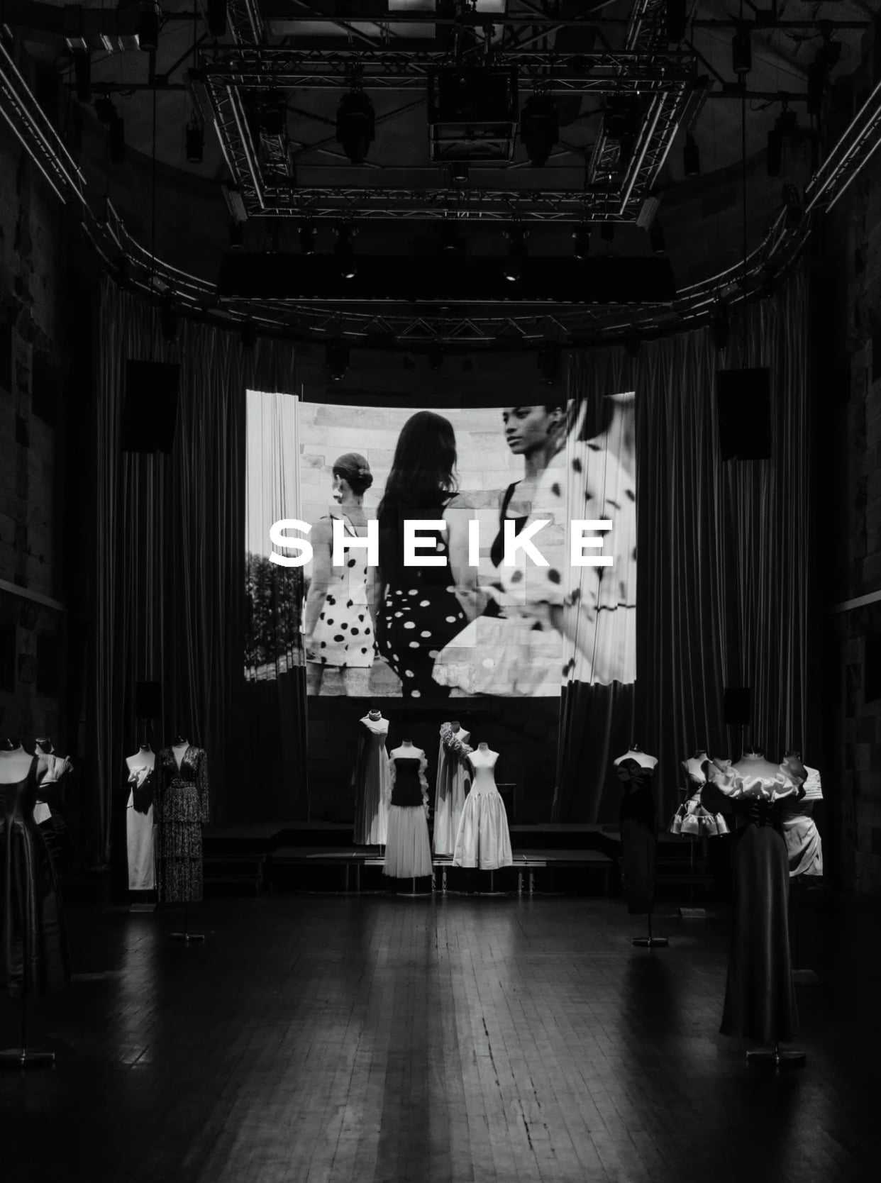 Sheike brand — a museum-like fashion showcase with the SHEIKE wordmark