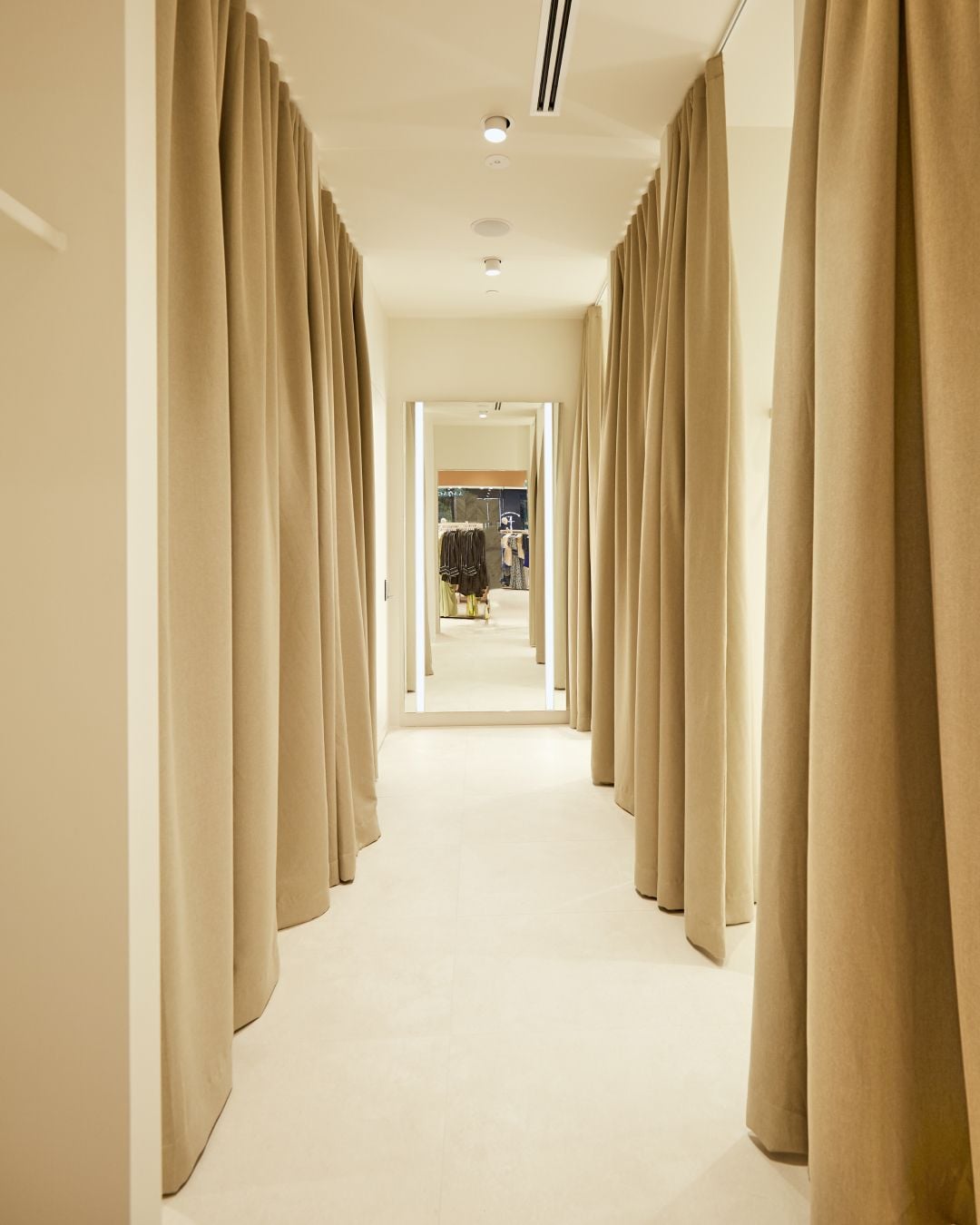Fitting-room corridor with linen curtains