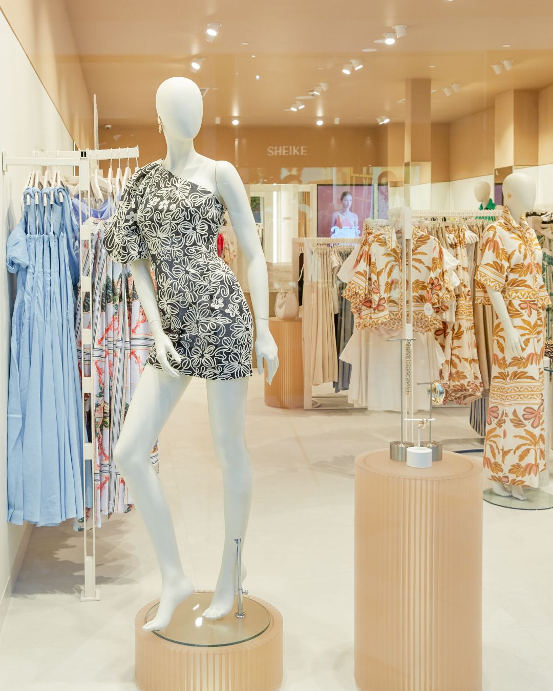 Store interior — floral look on a fluted plinth