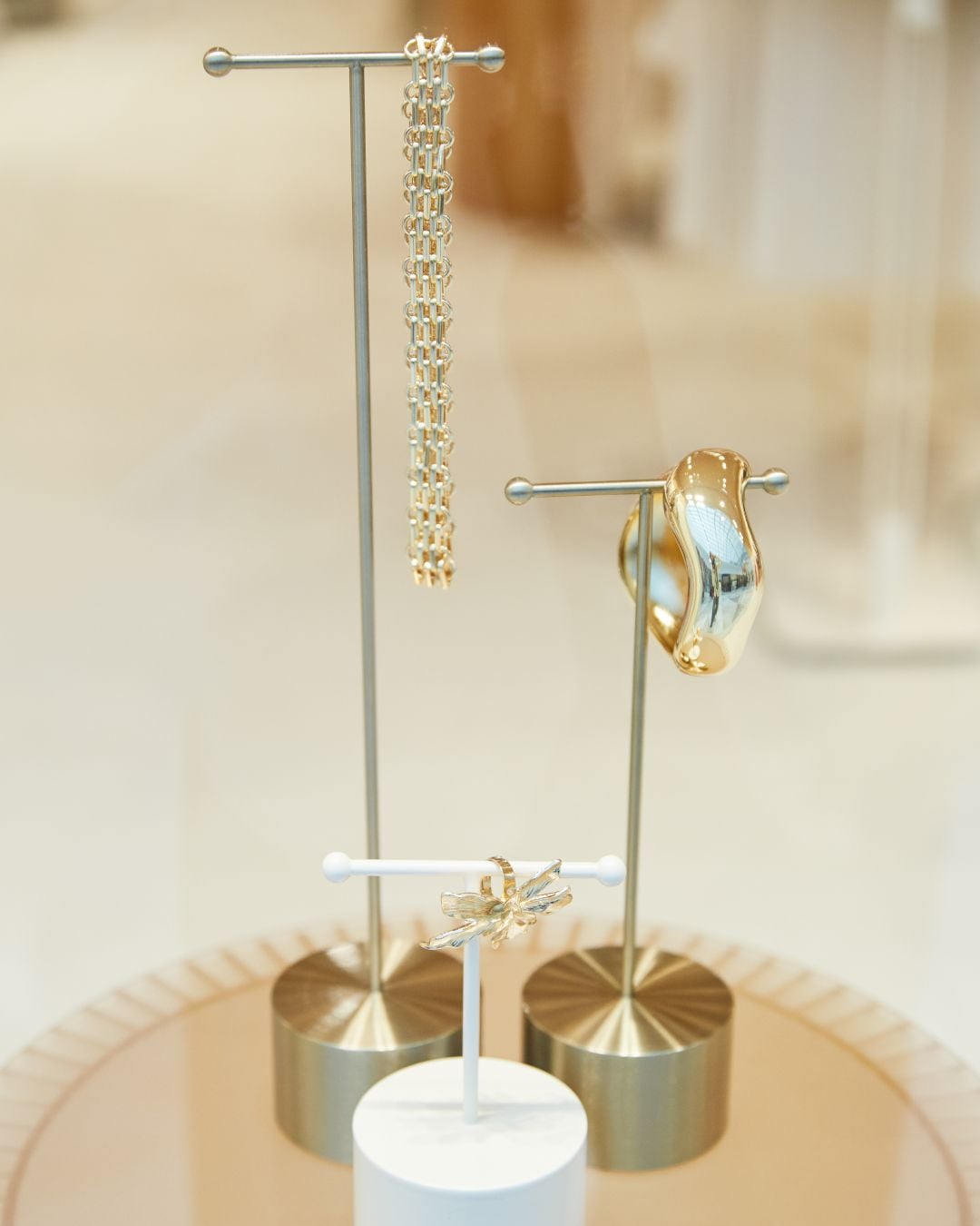 Jewellery display on brass T-stands