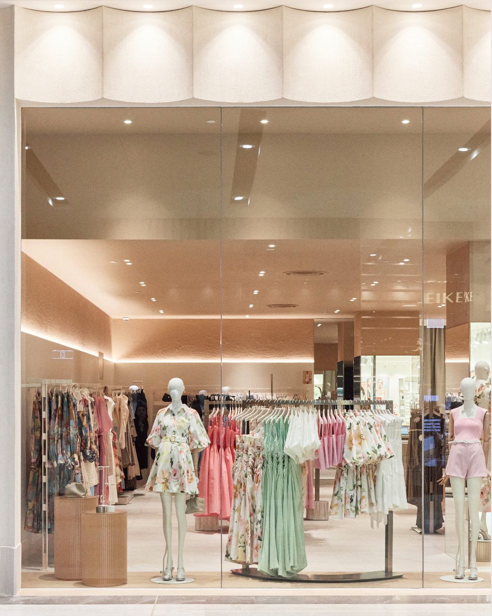 Window display — pastel range beneath warm downlights